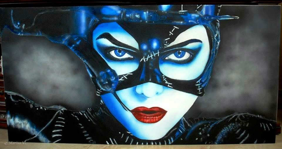 Very large horizontal canvas: Catwoman’s masked face in blues and blacks, red lips, against grey clouds.
