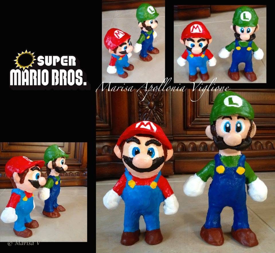 Two painted clay figurines of Mario and Luigi standing side by side on a tiled floor.